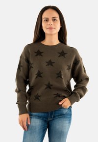 Maglione verde oliva con motivi a stella nera glitterati, scollo rotondo e polsini e orlo a coste. Tessuto morbido, vestibilità comoda.