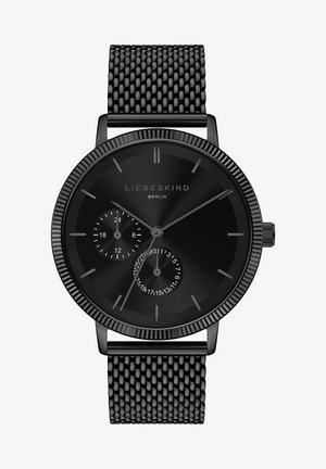 Sort mesh remekur med et rundt urkasse. Mat sort skive har minimalistiske timemarkører og en sub-skive til dato i et elegant design.