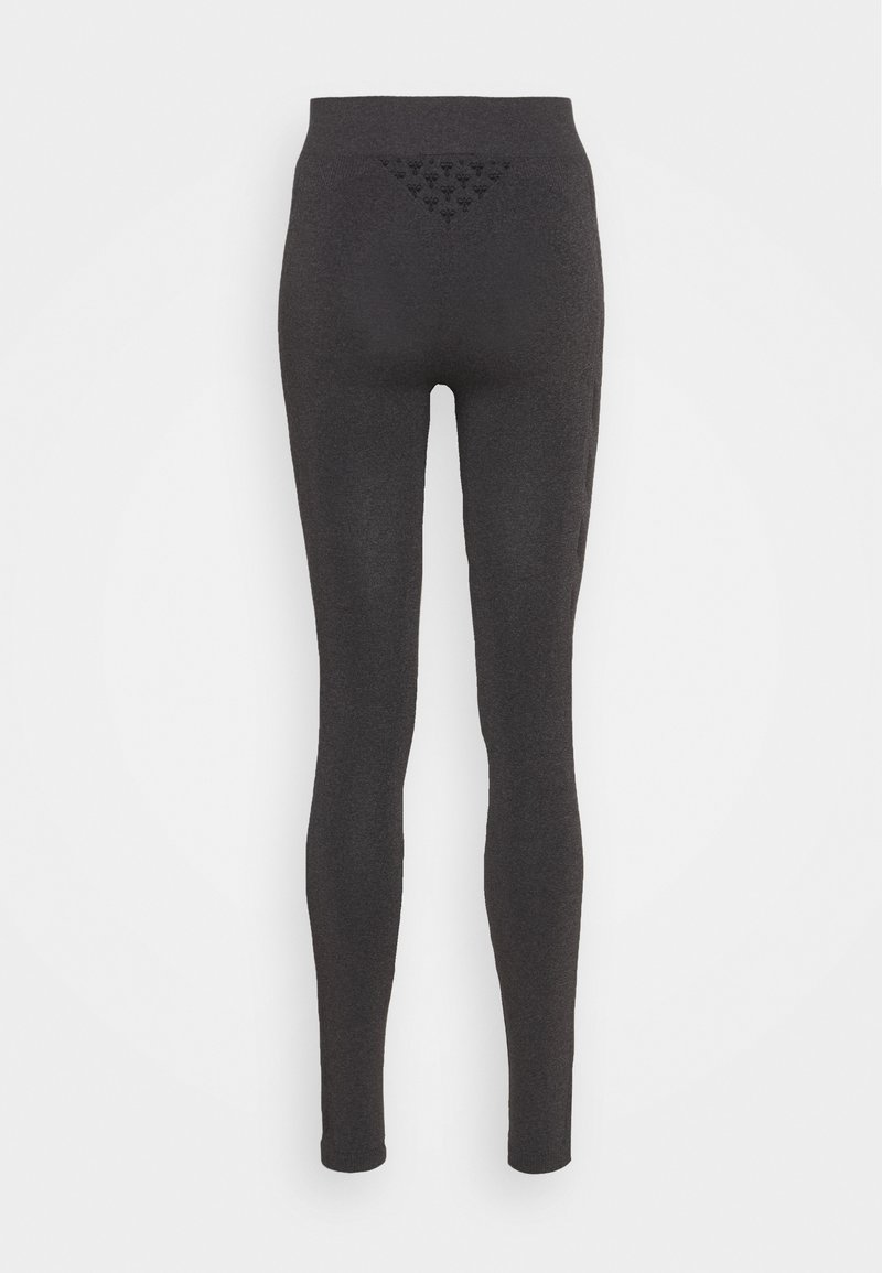 Leggings gris oscuro con cintura alta, hechos de material elástico, que cuentan con un panel trasero texturizado con patrón de triángulos y un diseño sin costuras.