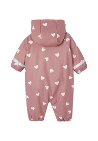 Pink waterproof snowsuit with white heart pattern, elastic cuffs, attached hood, and reflective strip on sleeves for visibility.