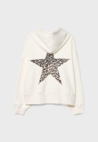 Krämfärgad hoodie med en leopardmönstrad stjärna på ryggen. Har en huva och en kortad design med ribbade manschetter och nederkant. Mjuk textur.