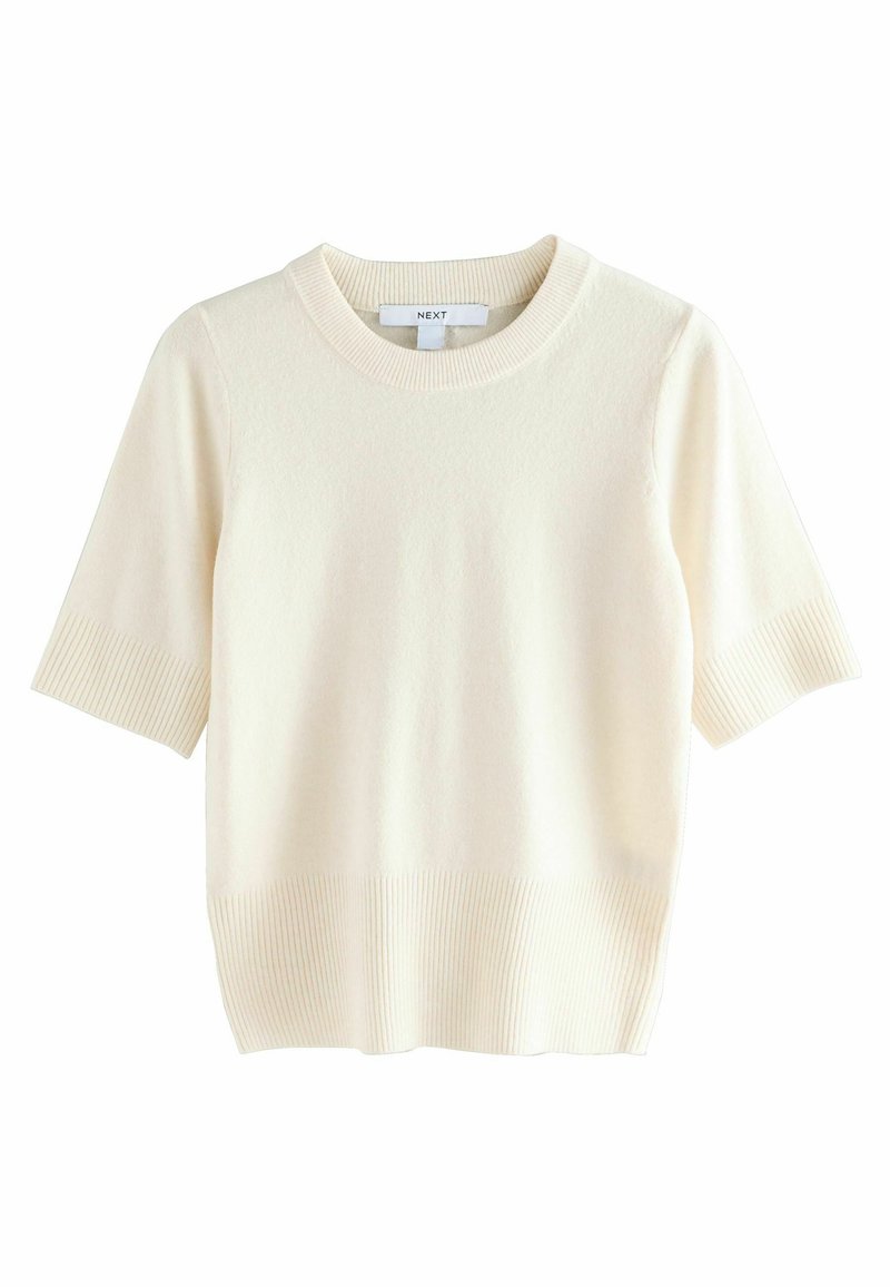 Pull à manches courtes, col rond en crème. Texture côtelée aux manches et à l'ourlet. Tissu en maille douce avec une finition lisse. Design léger.