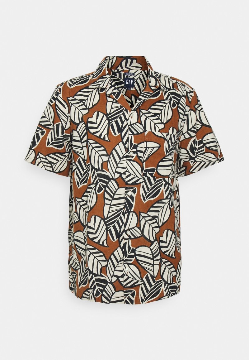 Camisa de manga corta, tipo polo, en marrón con un patrón de hojas en blanco y negro, con botones y un corte relajado. Material de algodón.