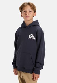 Navy blue cotton hoodie with a front pocket, a logo on the chest, and long sleeves featuring printed design on the sleeve.