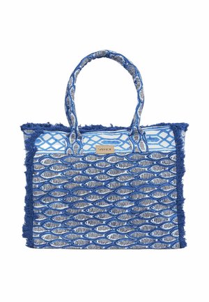 Blauw-witte geweven totebag met geometrische en visgraatmotieven, stoffen handvatten en franjes aan de randen, met een klein "Verde" label.