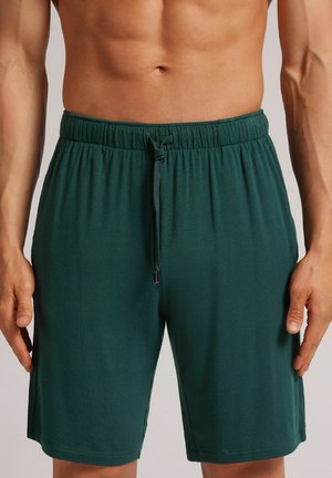 Pantalones deportivos - grün j dark green