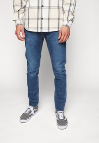 Levi's® 512® SLIM TAPER - Calças de ganga justas - z1962 medium indigo worn in