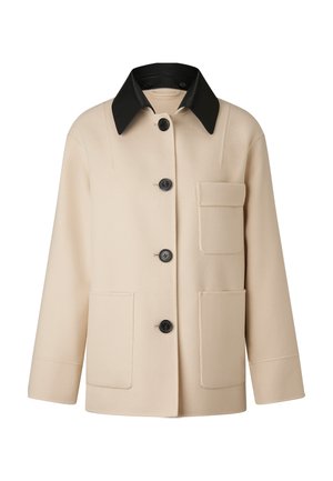 Beżowa kurtka z mieszanki wełny z czarnym skórzanym kołnierzem, z przodu zapinana na guziki, z dwoma dużymi kieszeniami i pudełkowatym krojem.