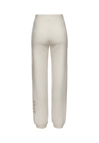 Helle Cremefarbene, aus Baumwollmischung bestehende Sweatpants mit lockerer Passform. Verfügt über einen breiten Taillenbund und das Wort "SAND", das auf dem linken Bein aufgedruckt ist.