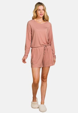 Pink patterned loungewear set featuring a long-sleeve top with a knotted front and matching shorts with an elastic waistband. Soft texture.