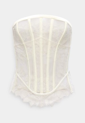 Kanten korset in off-white met doorschijnende stof, gestructureerde baleinen en een geschulpte kanten zoom, met een slanke, aansluitende silhouet.