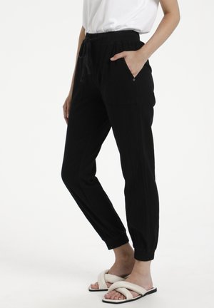 NAYA PANTS - Trousers - black deep