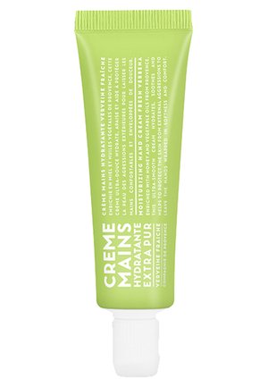 Zielona tuba nawilżającego kremu do rąk, z białym napisem, zakrętką na flip-top oraz gładkim, matowym wykończeniem. Zawiera ekstrakt z świeżej werbeny.