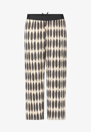 Pantalones de pierna ancha plisados con un patrón geométrico en negro y crema. Presentan una cinturilla elástica negra y una textura de tela suave y fluida.