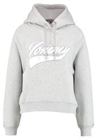 Grijze sweatshirt met capuchon, voorzien van een witte "Tommy" logo. Het heeft ribgebreide boorden en onderrand, ontworpen in een losse pasvorm met trekkoorden.