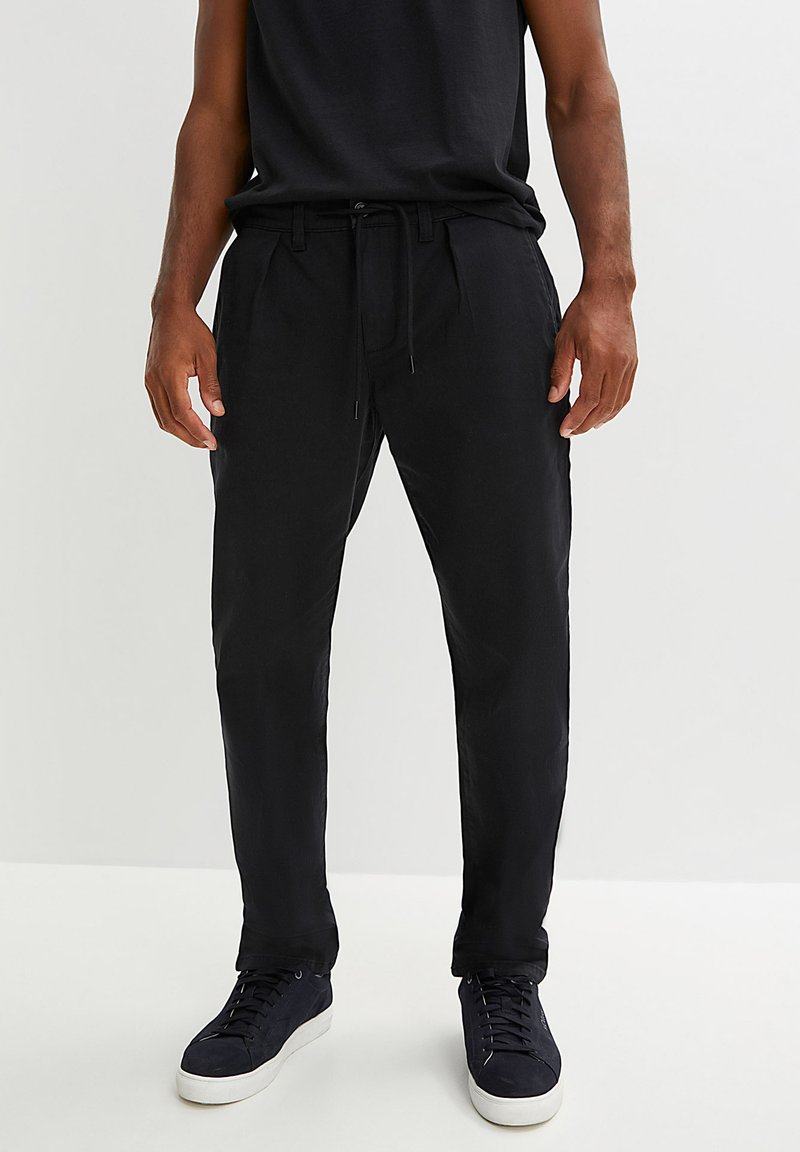 bonprix MIT BUNDFALTE Chino black/schwarz Zalando.ch