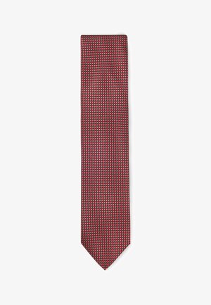 Red patterned tie featuring geometric designs in a dark background, made of smooth fabric with a tapered end and narrow width.