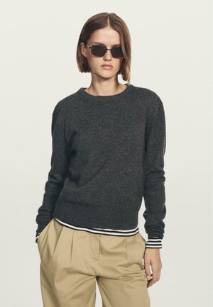 - Sweter