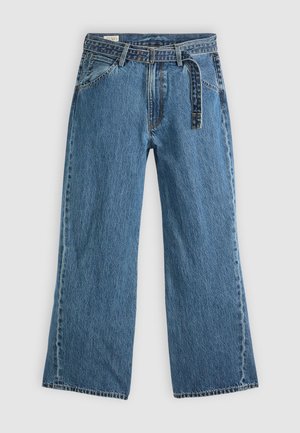 Wide-leg denim jeans in medium blue with a textured finish. Features a belted waist, front pockets, and stitched seams.