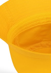 Yellow bucket hat with a soft fabric texture, wide brim, and a structured crown. Interior stitching is visible, enhancing overall design.