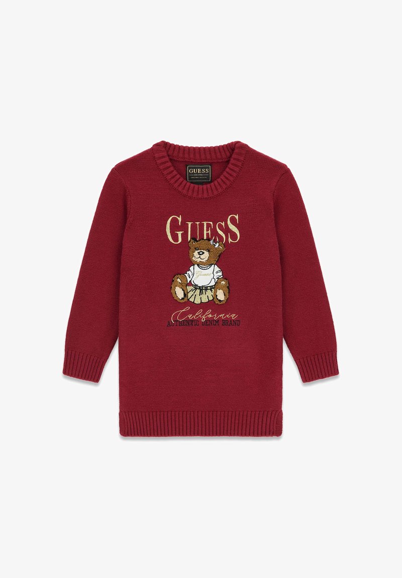 Piros kötött pulóver medve grafikával, arany betűzéssel "GUESS" és bordázott mandzsettákkal és aljjal. Puha, texturált anyagból készült.