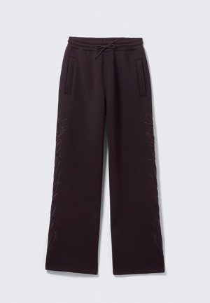 Dunkelpurpurne Jogginghosen mit elastischem Bund, Kordelzug, Seitentaschen und dezenten gestickten Details entlang der äußeren Beine.