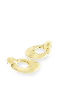 Boucles d'oreilles en métal doré avec un design abstrait et ondulé composé de formes arrondies et d'une finition polie. Fermetures à clou.