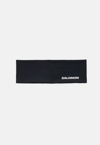 Fekete fejpánt sima, rugalmas anyagból; az egyik oldalán fehér "SALOMON" logóval. Téglalap alakú, lapos dizájn.