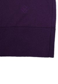 Purple knit sweater featuring a ribbed hem and a small, embossed logo in a diamond shape. Smooth texture with a snug fit design.