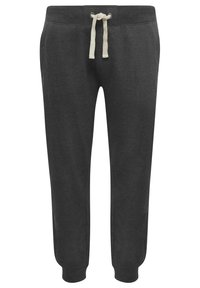 Pantalons de survêtement gris foncé en matériau doux, avec une taille à cordon de serrage et des liens beiges, et des poignets resserrés aux chevilles.