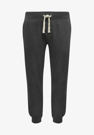 Donkergrijze sweatpants van zacht materiaal, met een trekkoord tailleband met beige stropdasjes en taps toelopende boorden bij de enkels.