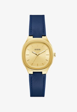 Montre-bracelet Guess ton doré avec cadran carré texturé, index horaires simples et bracelet en cuir bleu foncé avec surpiqûres.