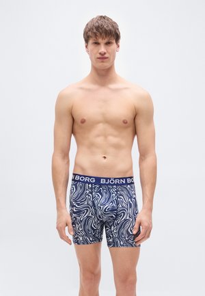 Boxershort met een blauw-wit golvend patroon, voorzien van een elastische tailleband met merklogo en een aansluitend ontwerp. Gemaakt van rekbare stof.