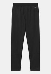 Pantalones deportivos negros con un diseño ajustado, cinturilla elástica y textura suave. Presentan una tela de alta elasticidad para mayor comodidad y movilidad.