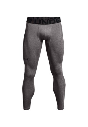 Graue Sportleggings mit taillierter Passform, aus dehnbarem Material gefertigt. Mit einem schwarzen Bund, auf dem der Markenname auffällig gedruckt ist.