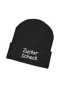 Black knitted beanie with a folded cuff. Features a rectangular patch reading "Zucker Schock" in white lettering. Smooth texture.