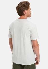 Lys grå kortærmet t-shirt med et spraglet mønster, rund hals og blødt stof. Set bagfra, med en lige afslutning.