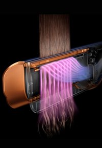 Hårplattare med genomskinlig kropp, bronserade accenter och rosa luftströmmar som visar uppvärmd luft riktad mot rätade hårstrån.