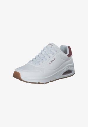 White sneaker with a smooth synthetic upper, perforated detailing, maroon heel accent, and a cushioned sole with visible air pocket.