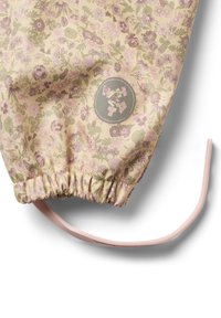 Blommönstrad tyg i ljus krämfärg med rosa och gröna nyanser; elastisk midja med dragsko; cirkulär logotypdetalj.