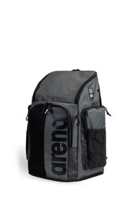Gray backpack with mesh and solid fabric sections, featuring multiple zippered compartments, adjustable straps, and a large logo on the side.