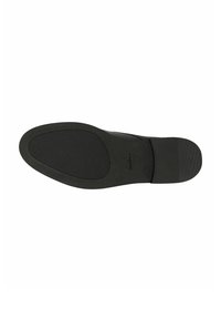 Sole di scarpa nera con superficie strutturata, punta tonda e tacco leggero. Finitura liscia con nome del marchio in rilievo.