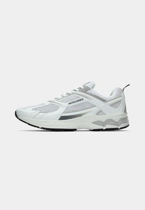 White athletic shoes with mesh and synthetic materials, featuring silver accents, a textured sole, and a lace-up design.