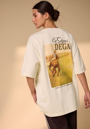 Next, REGULAR FIT - OVERSIZED LICENCE GRAPHIC T-SHIRT . - T-shirt con stampa - ecru