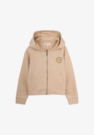 Sweat à capuche beige à fermeture éclair, fabriqué en tissu doux, avec des poches avant et un badge logo rond sur la poitrine gauche. Capuche avec poignets et ourlet élastiques.
