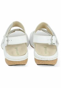 Sandales blanches avec une semelle intermédiaire en liège, sangle réglable, tige en cuir lisse et semelle intérieure rembourrée ; design simple et ouvert à l'arrière, idéal pour les temps chauds.