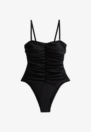 Zwarte badpak met verstelbare straps, geplooide details aan de voorkant en een hoog uitgesneden beenontwerp. Gladde stof met een matte afwerking.