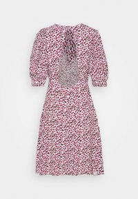 Floral print dress in pink and white, featuring puff sleeves, a back cutout, and a flowing silhouette. Made from lightweight fabric.