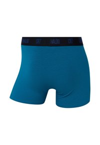 Blå bomuldsboxershorts med en sort talje, der har "CR7" i blåt skrift. Glat tekstur og tætsiddende design. Egnet til daglig brug.