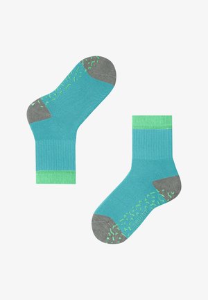 Chaussettes en coton turquoise avec un orteil et un talon gris, dotées d'un design de grip texturé en vert lime et d'un poignet côtelé.